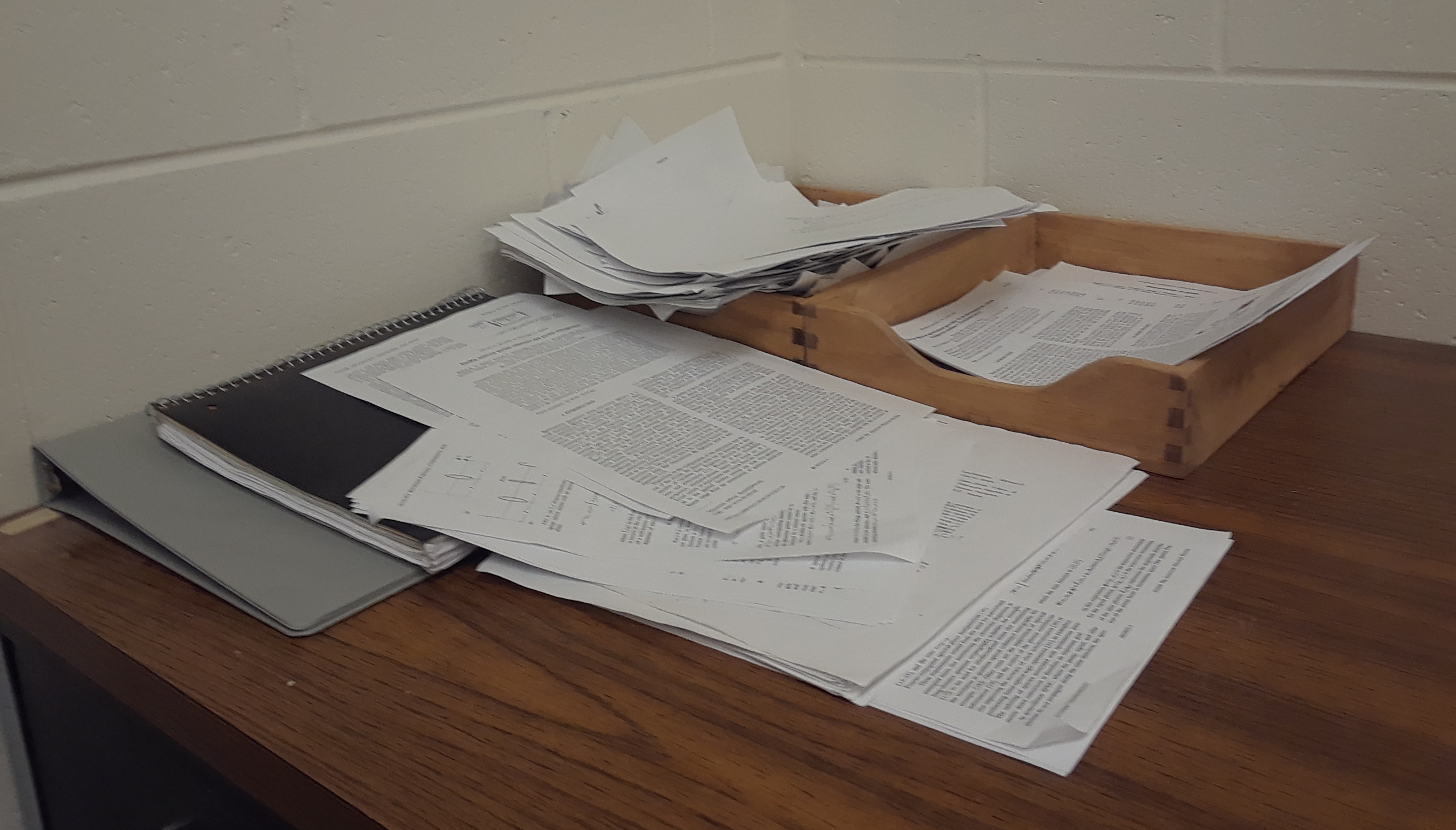 In/Outboxes in their natural habitat—my desk, strewn with papers